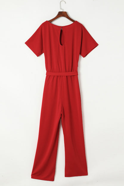 Vurige rode jumpsuit met wijde pijpen en riem