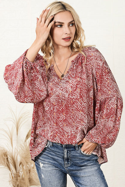 Vurige rode geplooide blouse met abstracte print en lantaarnmouwen