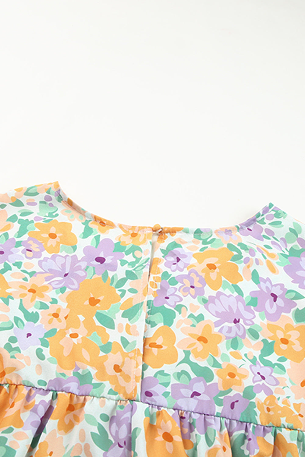 Babydollblouse met gele bloemenprint en keyhole-achterkant met korte mouwen