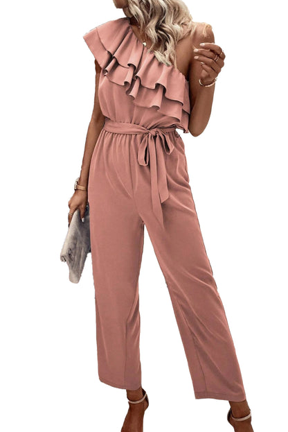 Stoffig roze jumpsuit met één schouder en ruches en riem