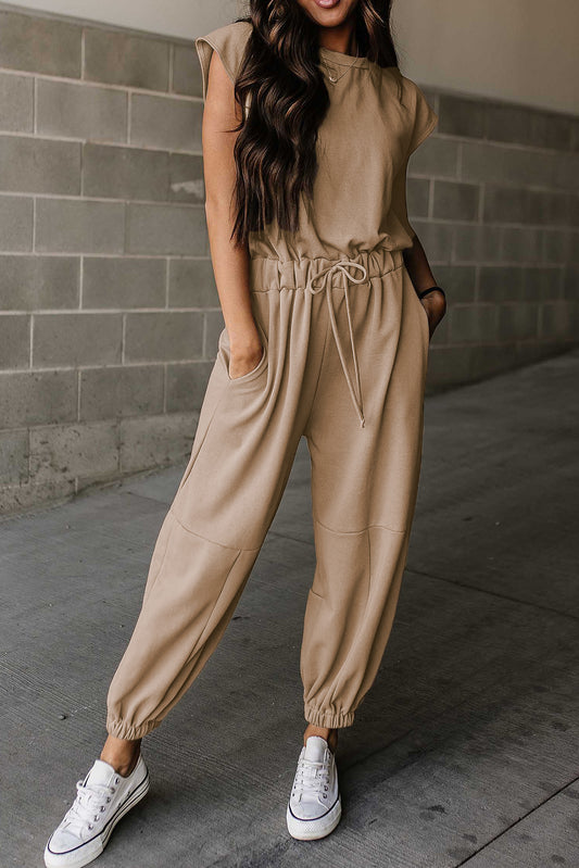 Licht Frans beige joggingbroek met kapmouw en open rug met trekkoord