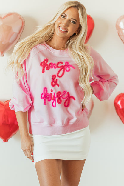 Roze knuffels en kusjes pop -up geborduurd raglan mouw sweatshirt