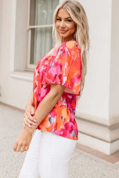 Vurige rode blouse met bloemenprint en wijde mouwen