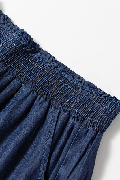 Zeilblauwe zijzakken, gesmokte jeans met hoge taille en wijde pijpen