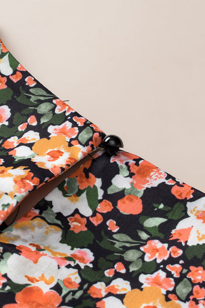 Oranje blouse met ruches, gesmokte manchetten en bloemen