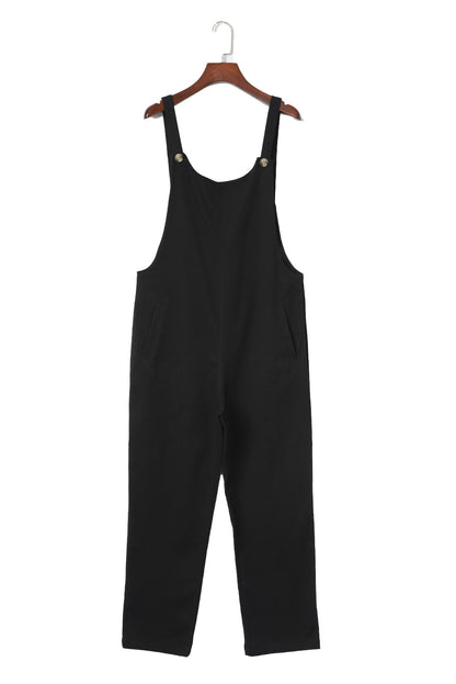 Zwarte cropped jumpsuit met knoopriemen en zakken