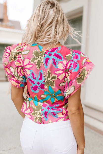 Veelkleurige, levendige bloemenprint bijgesneden blouse met ruches aan de mouwen