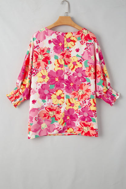 Roze gesmokte manchetten en bloemenblouse met 3/4 mouwen