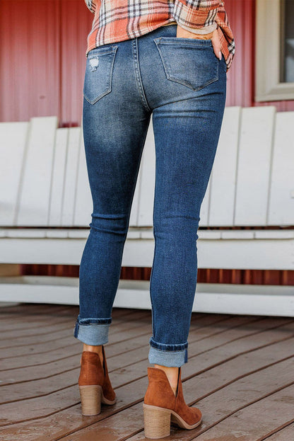 Blauwe noodlijdende skinny jeans met hoge taille en knoopsluiting