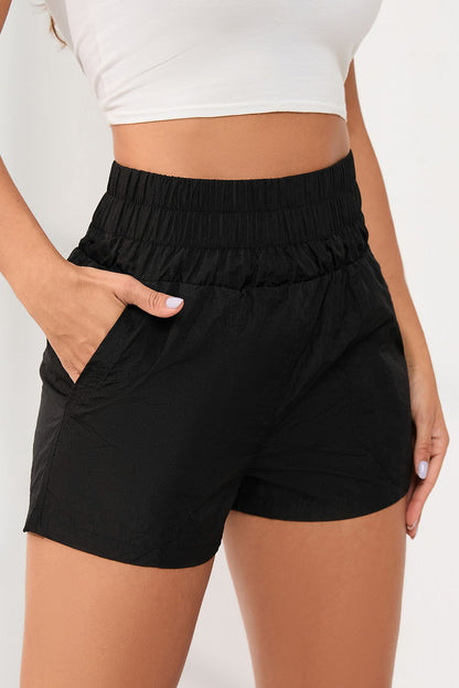 Zwarte elastische short met hoge taille en zijzakken