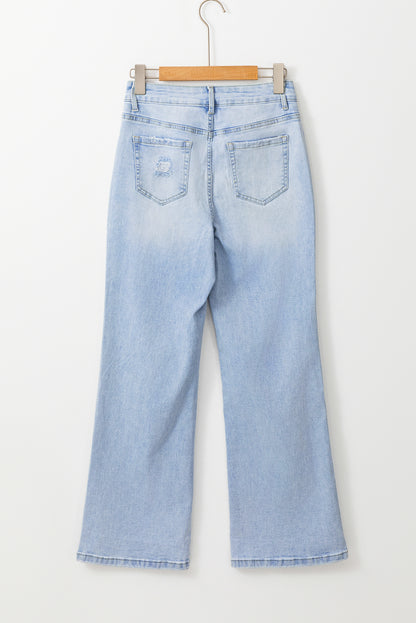 Beau blauwe vintage lichte wassing van verontruste flare-jeans