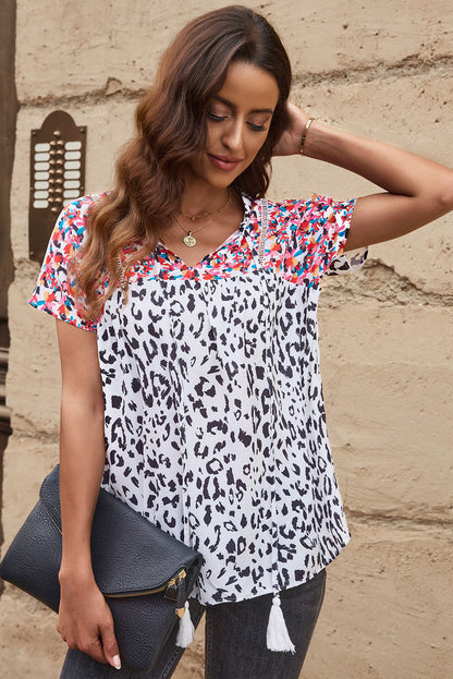 Blouse met luipaardmix en kwastjes