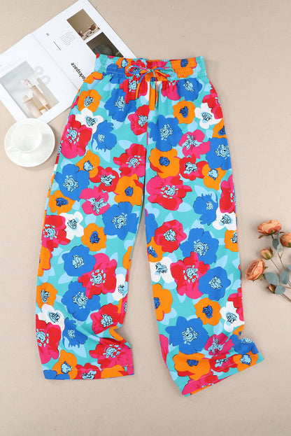 Broek met veelkleurige abstracte bloemenprint en trekkoord met brede tailleband