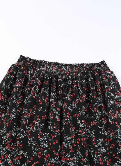 Zwart veelkleurige crop top en maxirok met bloemen en ruches