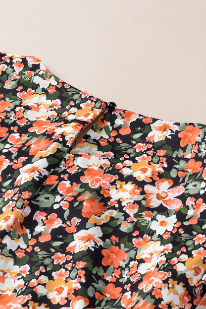 Oranje blouse met ruches, gesmokte manchetten en bloemen