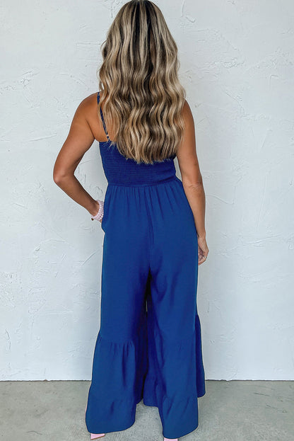 Marineblauwe spaghettibandjes gesmokte jumpsuit met wijde pijpen en ruches