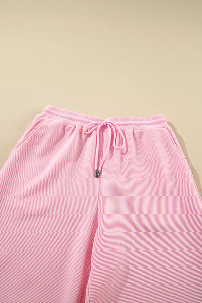 Roze textuur gegolfde mouw ritssluiting en brede pootbroek set