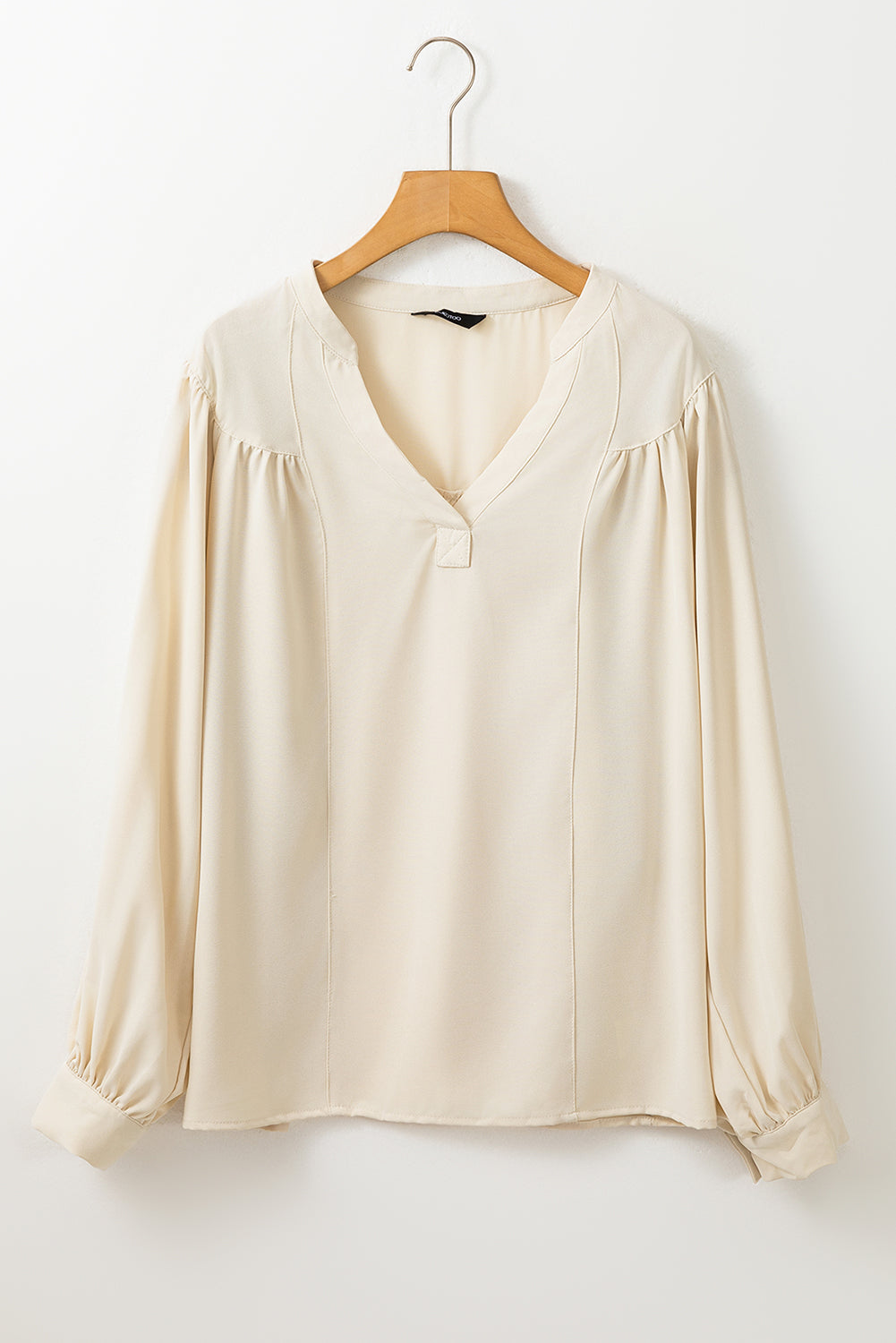 Witte blouse met effen kleur en lantaarnmouwen met ingekeepte V-hals