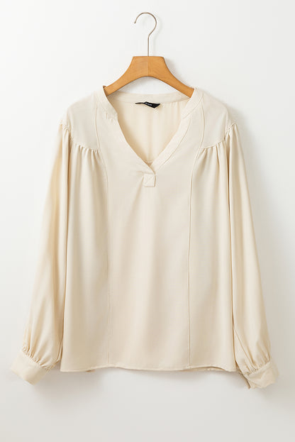 Witte blouse met effen kleur en lantaarnmouwen met ingekeepte V-hals