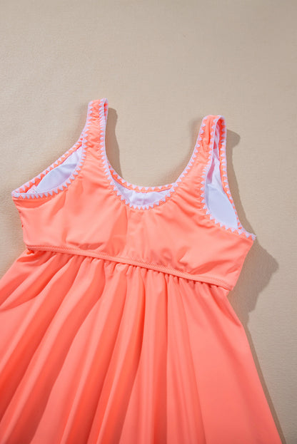 Tankini-badpak met frisse zalm en contrasterende rand met ruches en peplum-top