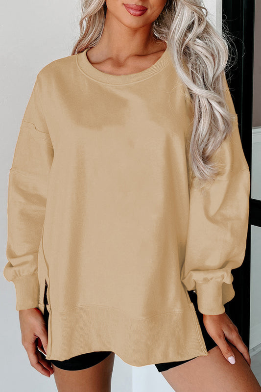 Licht Frans beige blootgestelde naad drop schouder ronde nek sweatshirt met spleten