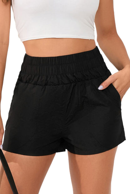 Zwarte elastische short met hoge taille en zijzakken