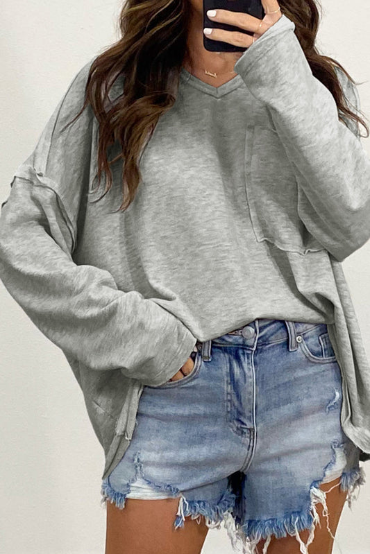 Grijze oversized top met verlaagde mouwen en zakken