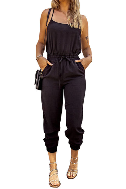 Zwarte jumpsuit met spaghettibandjes en trekkoord in de taille