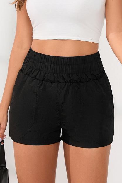 Zwarte elastische short met hoge taille en zijzakken