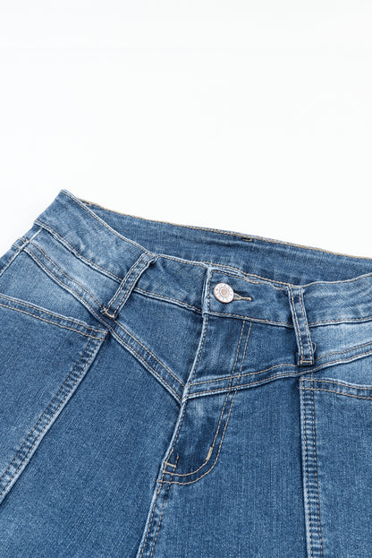 Blauwe zakflare-jeans met hoge taille en stiksels