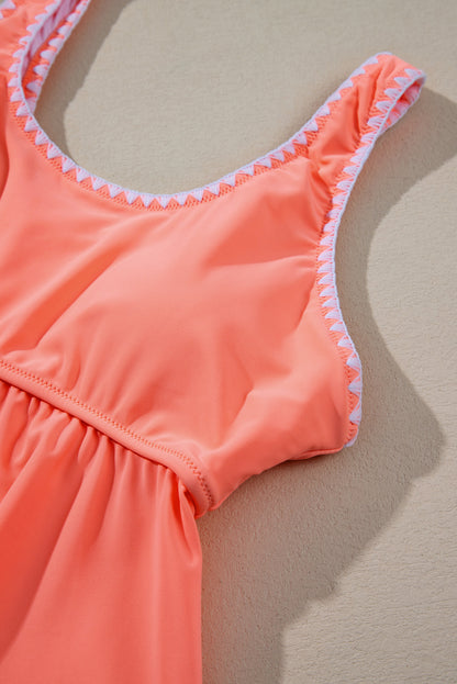 Tankini-badpak met frisse zalm en contrasterende rand met ruches en peplum-top