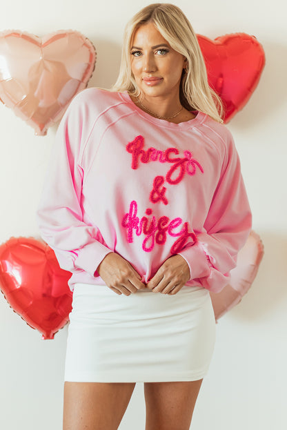 Roze knuffels en kusjes pop -up geborduurd raglan mouw sweatshirt