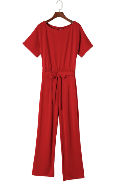 Vurige rode jumpsuit met wijde pijpen en riem