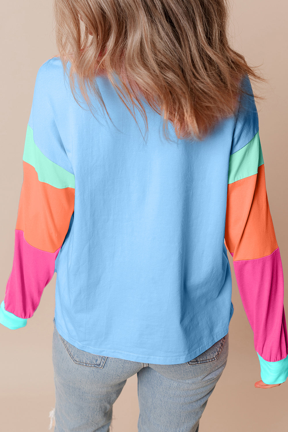 Donkerblauwe losvallende top met colorblock-patchwork en lange mouwen