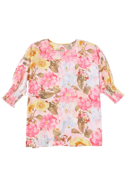 Roze gesmokte manchet, losse pasvorm met 3/4 mouwen en bloemenblouse