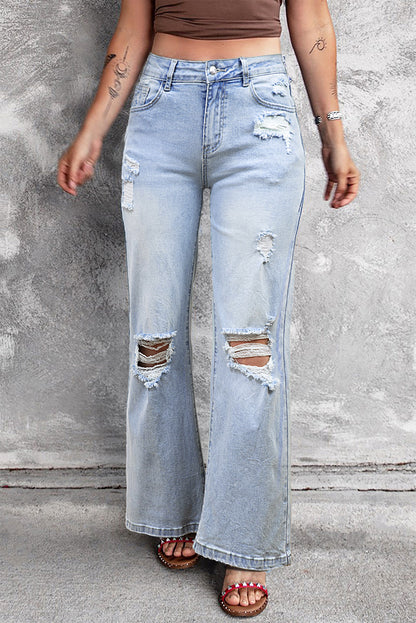 Beau blauwe vintage lichte wassing van verontruste flare-jeans