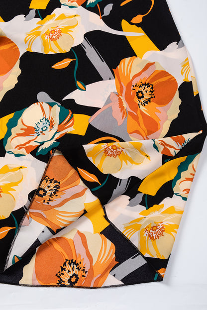 Oranje jurk met bloemenprint en strikhals en lange mouwen