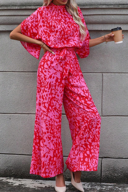 Roze luipaard jumpsuit met wijde pijpen, losse mouwen en riem