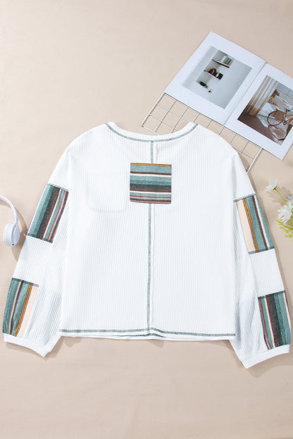 Witte gestreepte patchwork top met zichtbare naad en wafelmotief