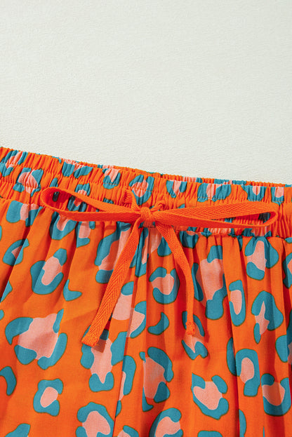 Oranje luipaardprint pyjamaset met lange mouwen en korte broek