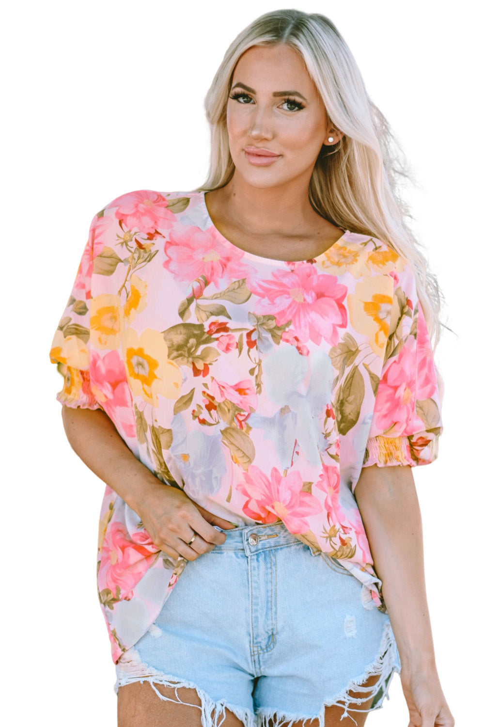 Roze gesmokte manchet, losse pasvorm met 3/4 mouwen en bloemenblouse