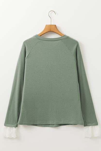 Grasgroene naad details kanten contrast manchetten raglan mouw top