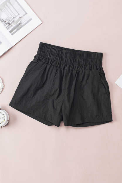 Zwarte elastische short met hoge taille en zijzakken